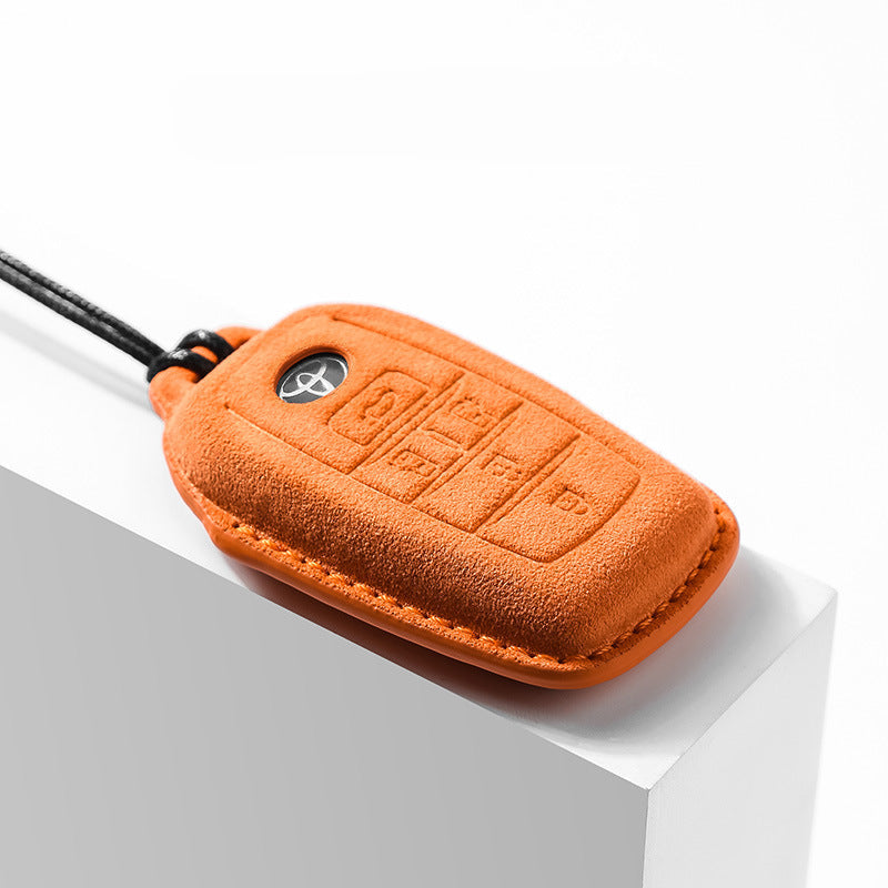 Orange suede Alcantara key cover for Toyota key fob with durable keyring attachment