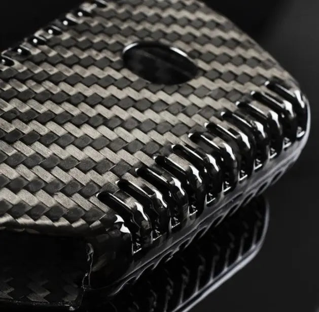 Close-up dry carbon fiber texture – Škoda key fob cover detail