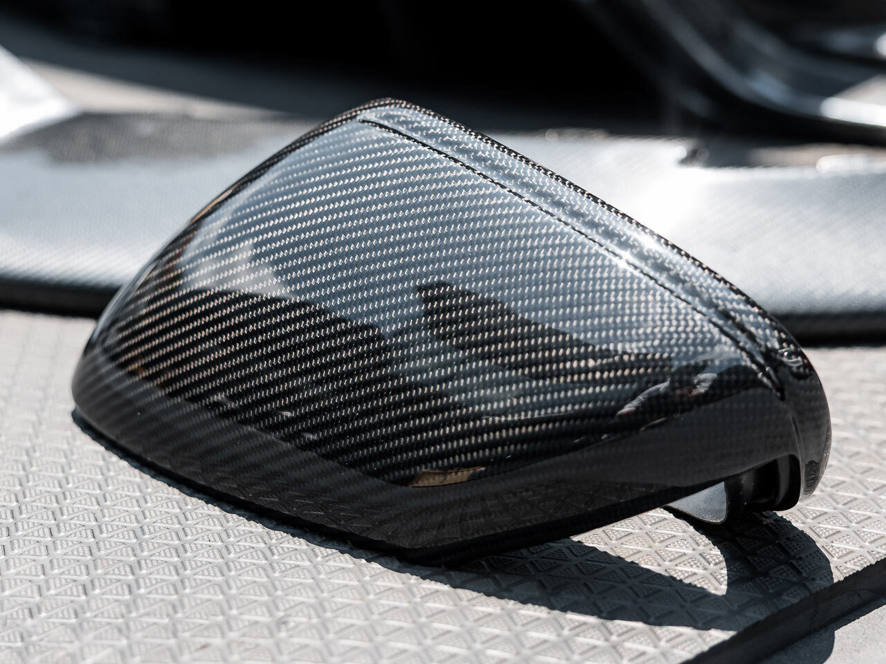 Top view of carbon fiber mirror cap on Porsche 911 992 – gloss housing