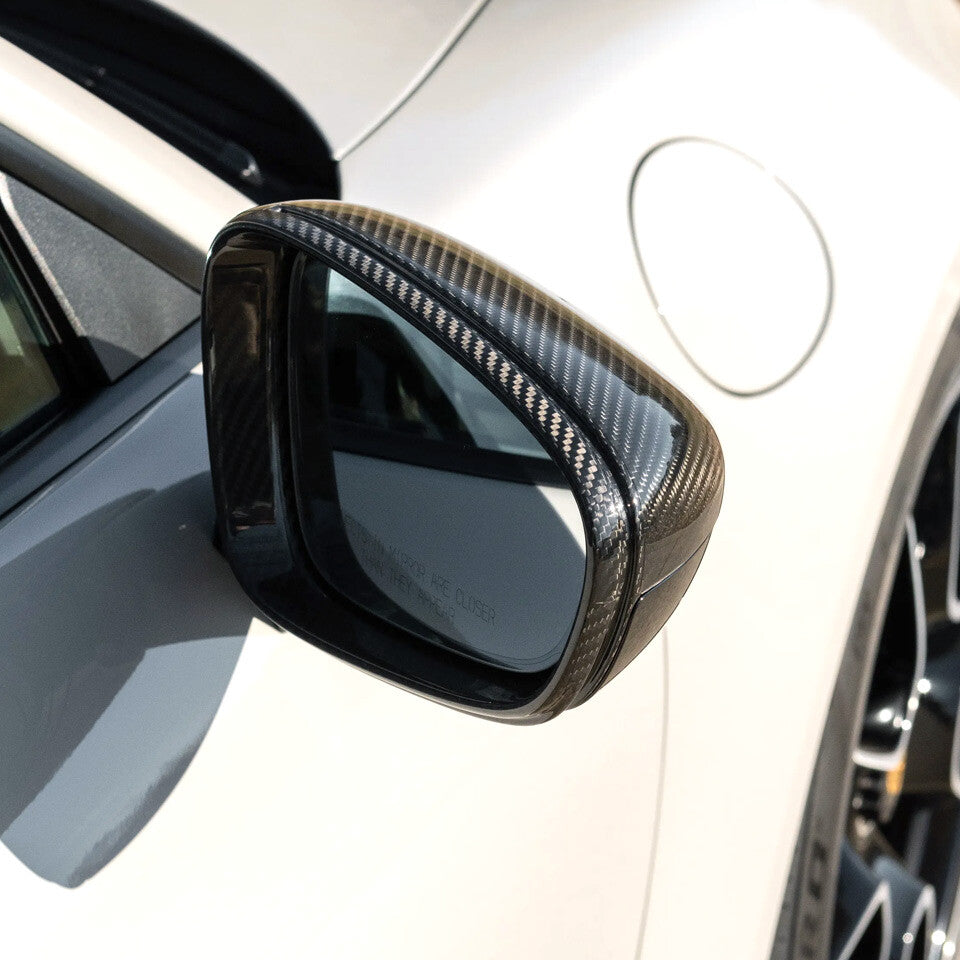 Right side carbon fiber mirror cap installed on Porsche 911 992