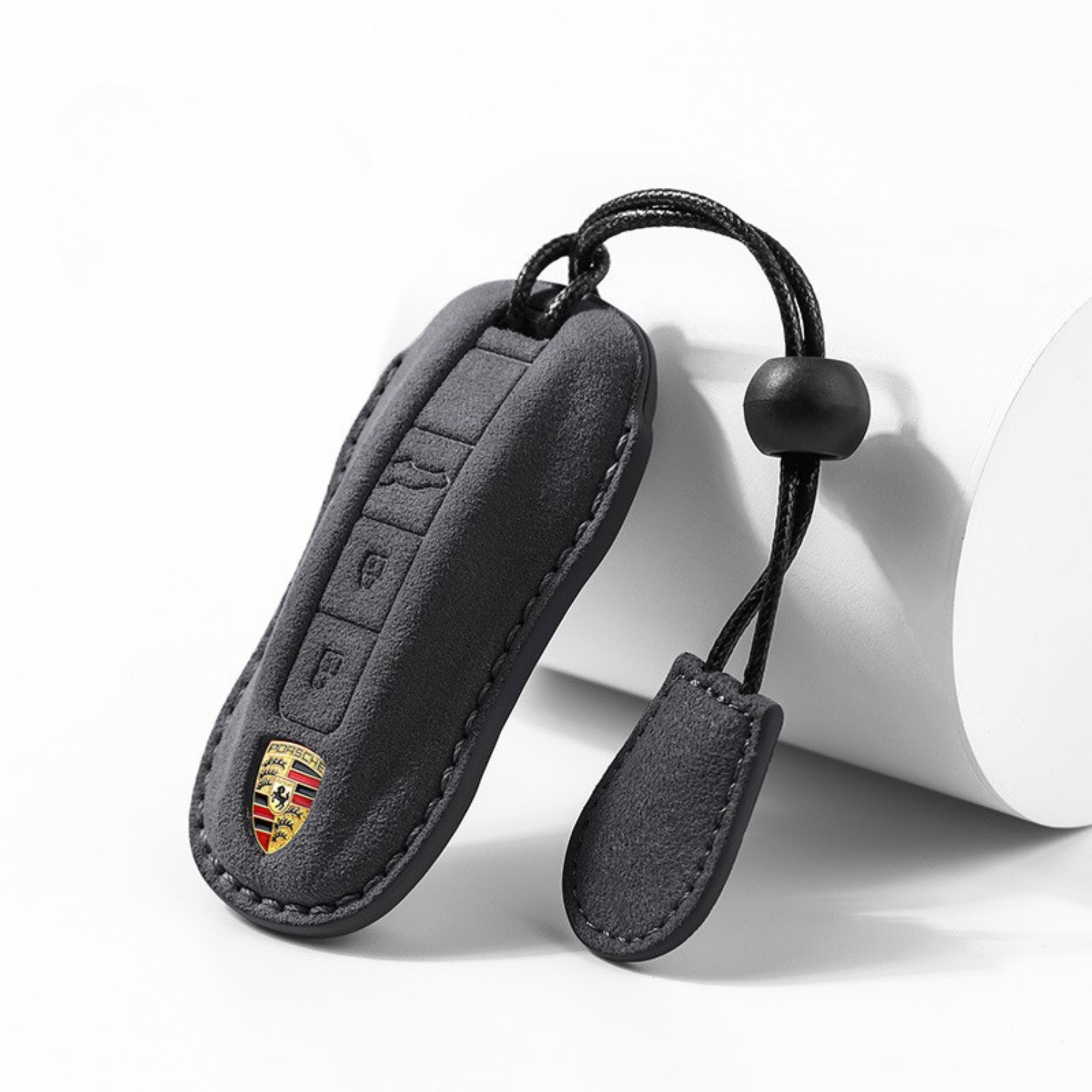 Black Porsche Alcantara key cover with loop – premium suede finish


