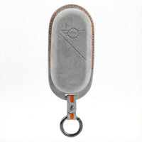 MINI Alcantara suede key fob cover in light grey (orange stitching)