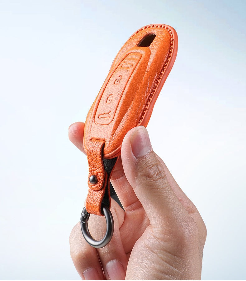 Porsche Type C sheepskin key cover - Orange in hand