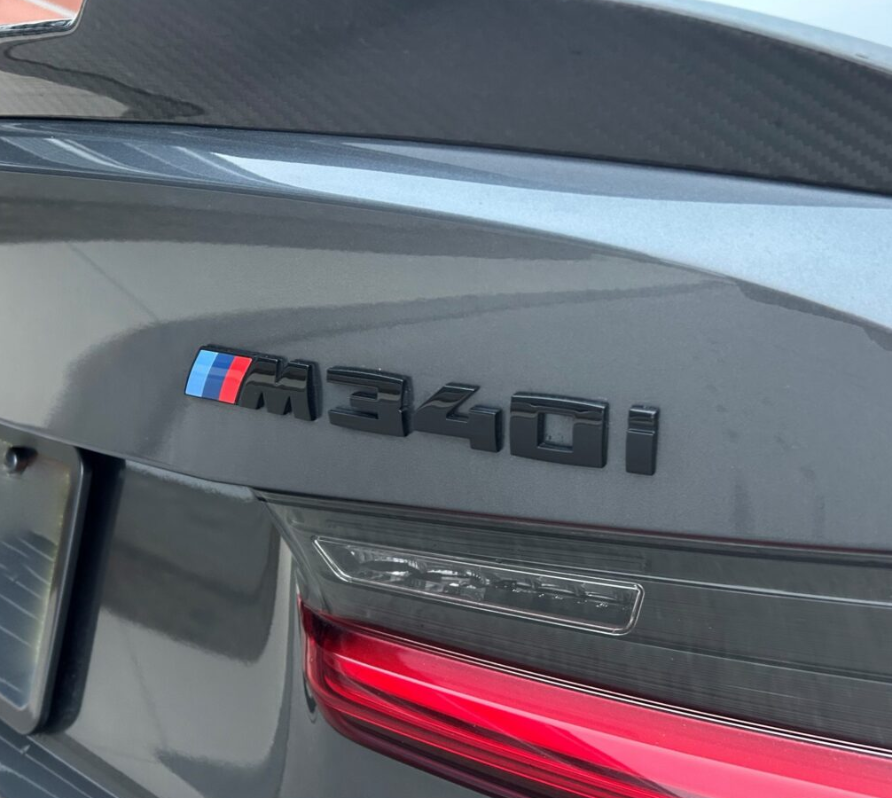 BMW M340i badge installed on G20 rear – gloss black emblem

