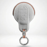 MINI Alcantara suede key fob cover in light grey (orange stitching)