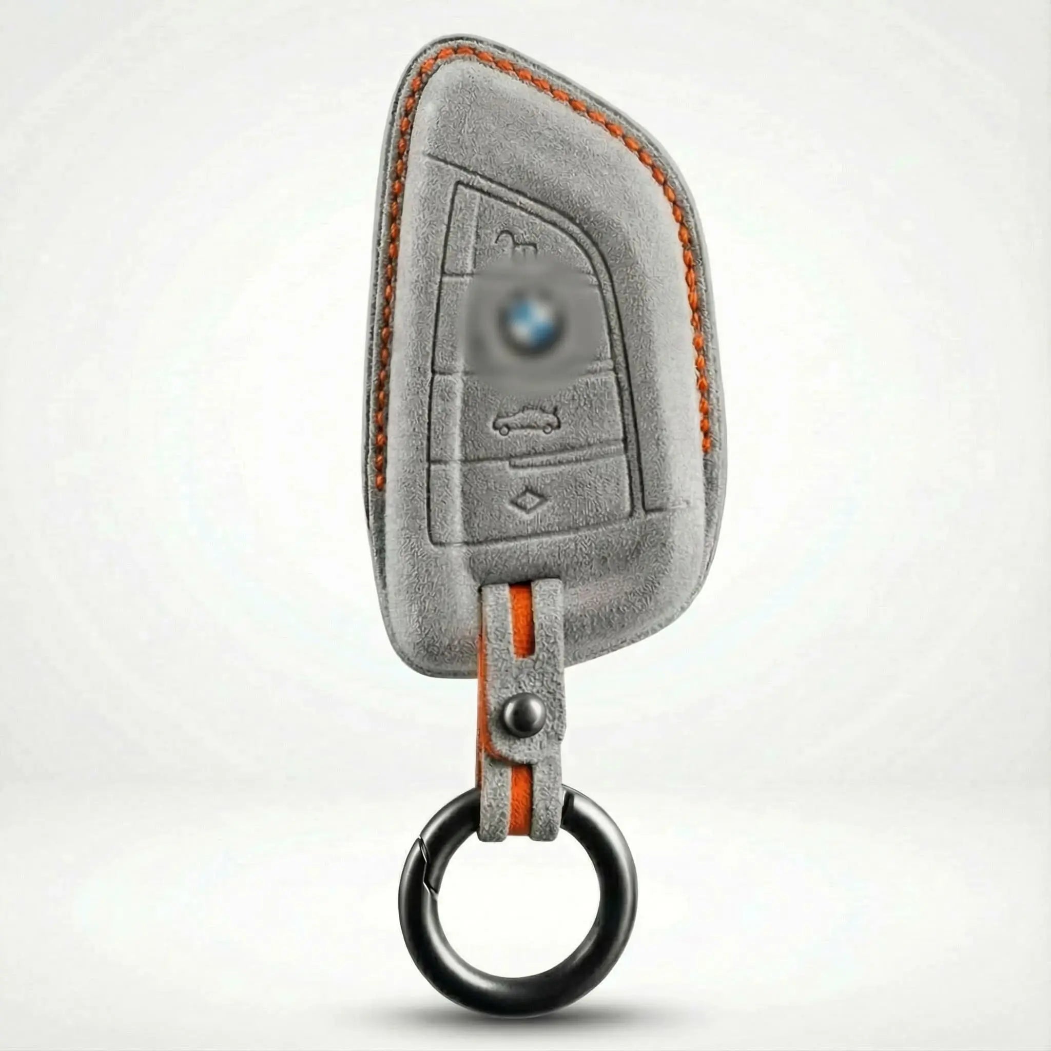 Gray car key fob cover with BMW logo on a white background