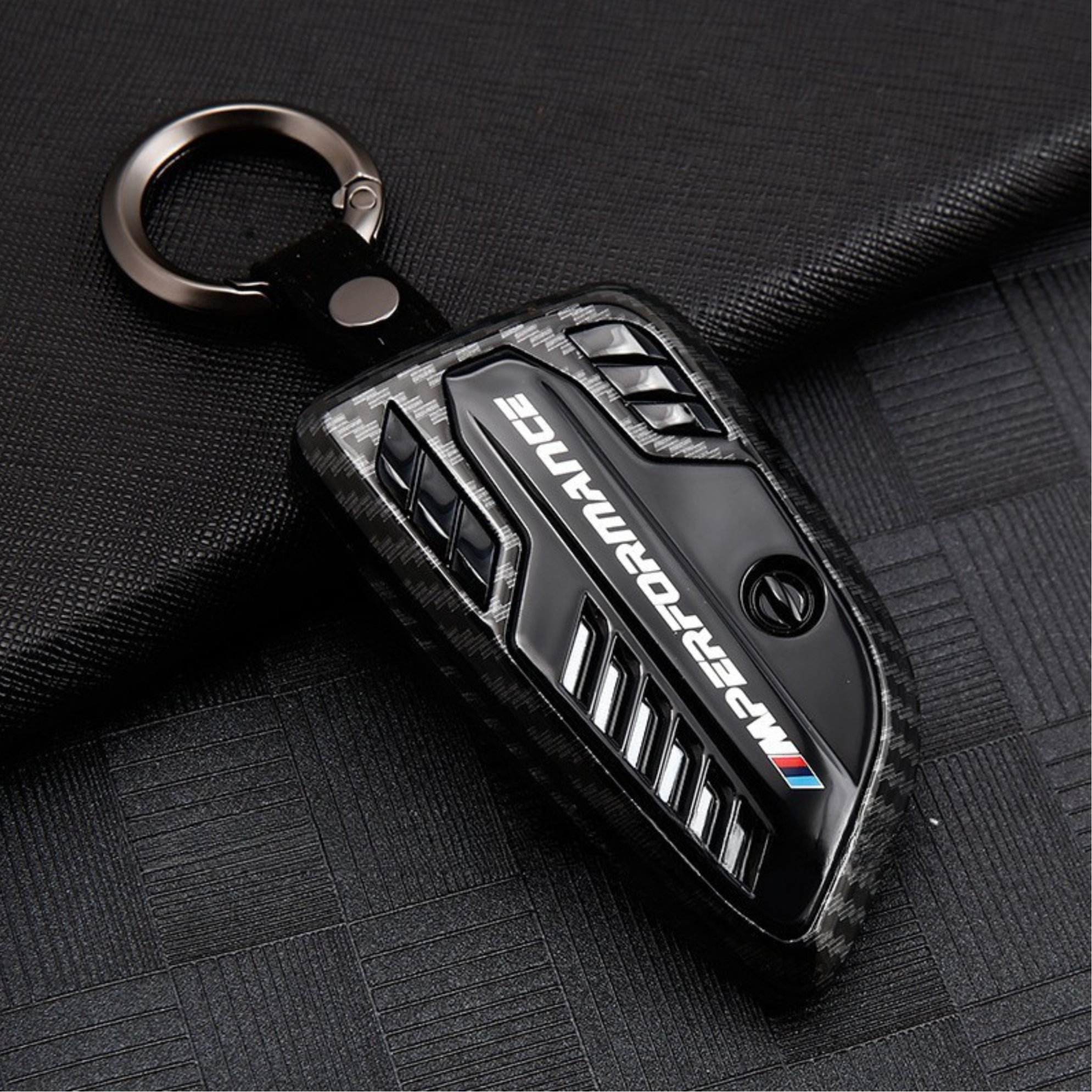 BMW M Performance carbon fiber key cover with a sleek, high-gloss finish and durable construction, offering premium protection and luxury styling.