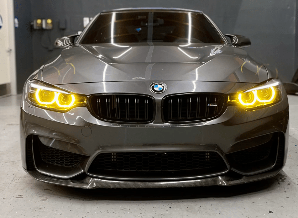 Front view of BMW F30 CSL yellow DRL module installed on Pre-LCI Xenon headlights, enhancing visibility and giving an M-inspired aggressive look