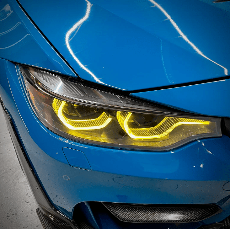 Front view of BMW F80 M3 featuring CSL Yellow DRL LED modules, enhancing daytime visibility and adding a sporty aesthetic.