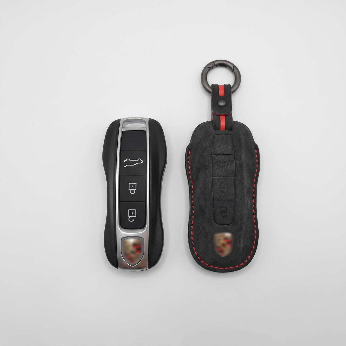 Porsche Type B key next to the Alcantara cover with red stitching, showing the moulded fit