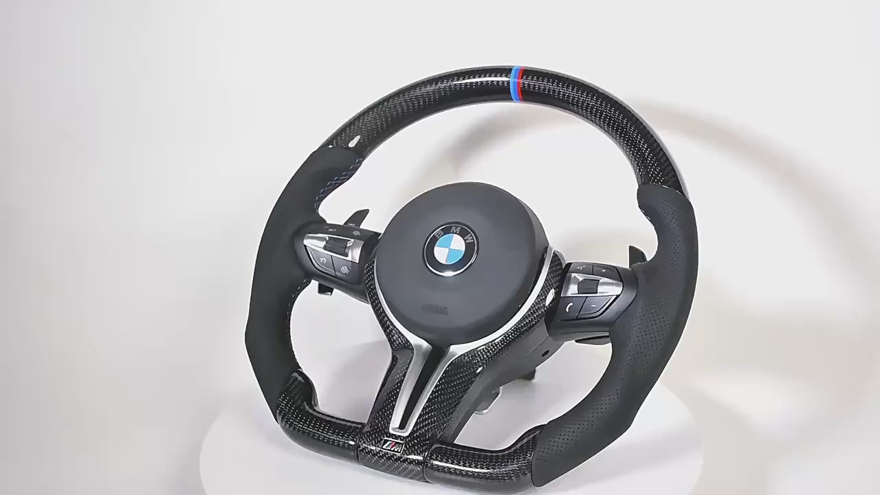 Close-up of real carbon fiber texture on BMW steering wheel

