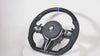 Close-up of real carbon fiber texture on BMW steering wheel

